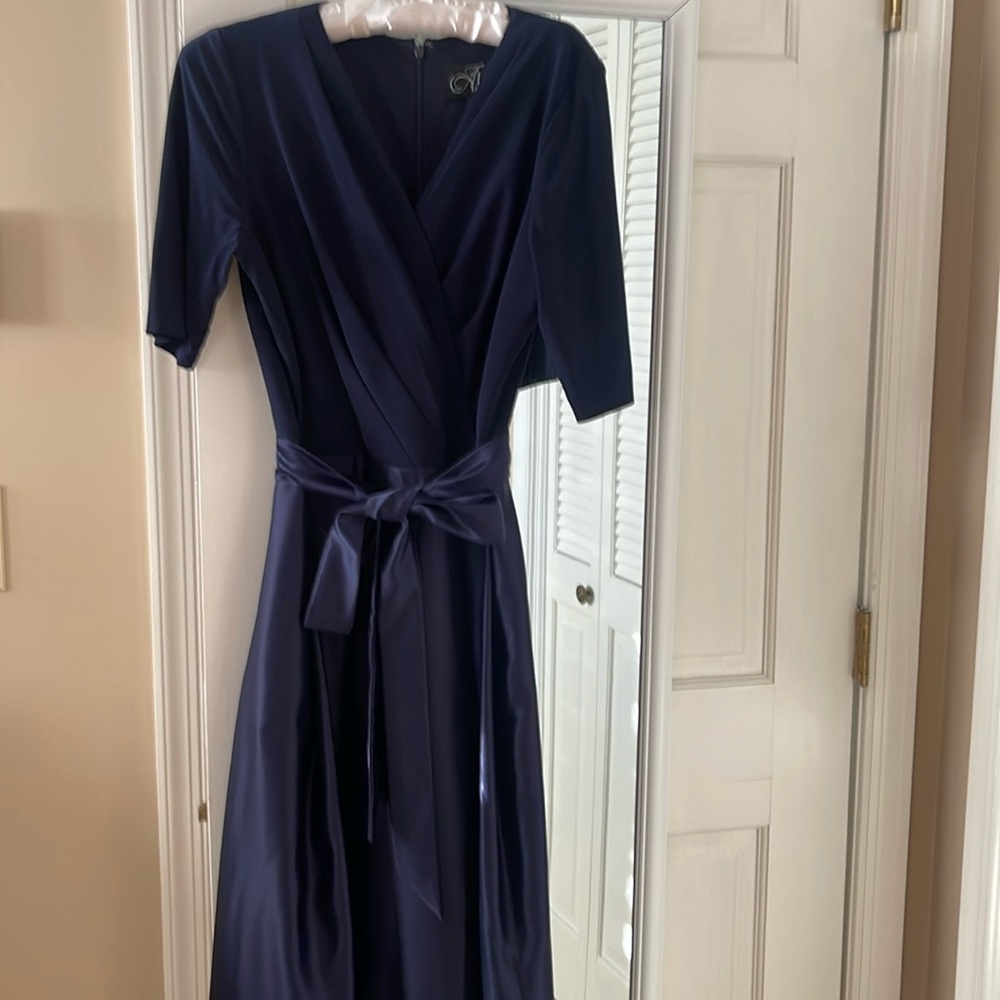 Dress worn one time to a formal wedding, runs small.